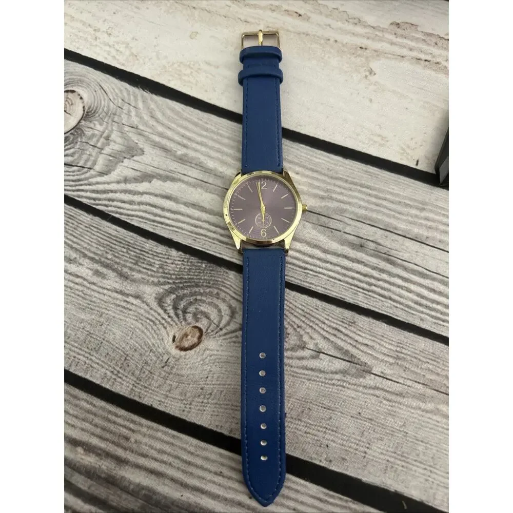 Gold Tone Case Purple Dial Blue Band Women’s Quartz Watch